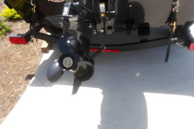 Slide: The Image of Rear view of 2026 Tracker Super Guide V-16 T boat with propeller and trailer. - 6