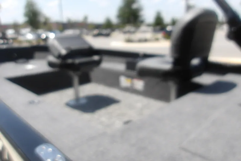 Slide: The Image of Blurry interior of 2026 Tracker Super Guide V-16 T boat with seating. - 9