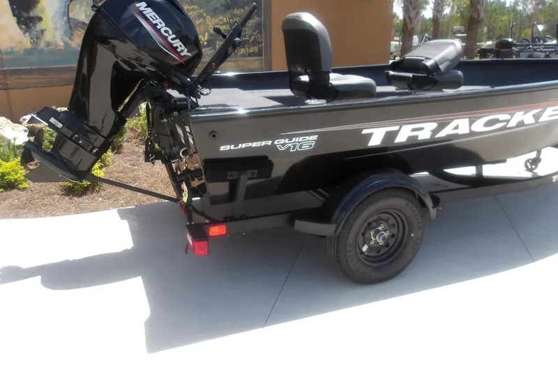 Slide: The Image of 2026 Tracker Super Guide V-16 T boat with Mercury outboard motor on a trailer. - 3