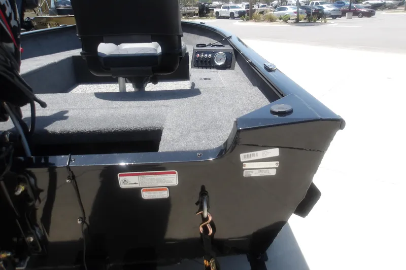 Slide: The Image of 2026 Tracker Super Guide V-16 T boat interior with seating and control panel. - 5