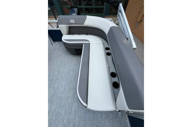 Slide: The Image of 2026 Sun Tracker Bass Buggy 16 XL Select boat interior with gray seating and cup holders. - 7