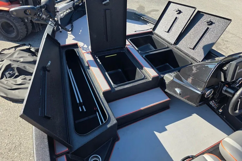 Slide: The Image of 2023 Xpress H17 boat interior with open storage compartments and seating. - 14