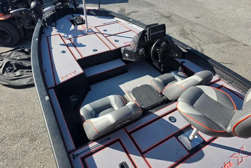 Slide: The Image of 2023 Xpress H17 boat interior with seating and steering console, featuring modern design elements. - 12