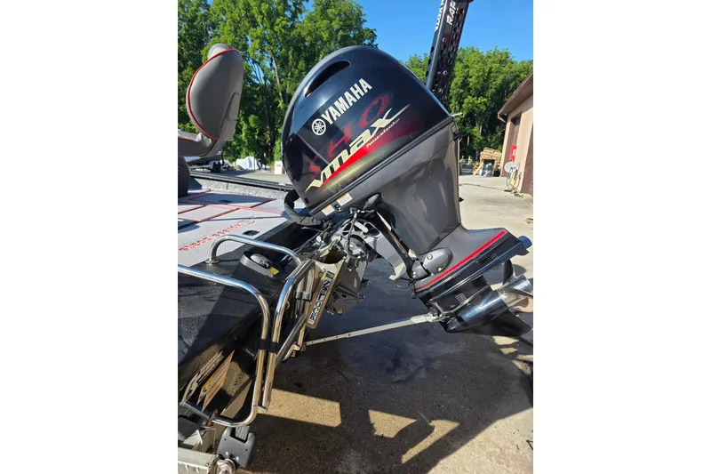 Slide: The Image of 2023 Xpress H17 boat with Yamaha VMAX engine, parked outdoors. - 10