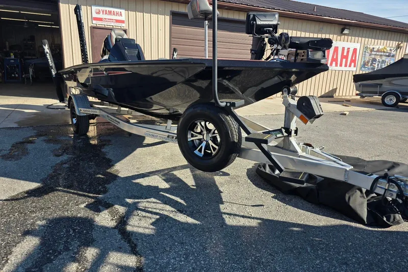 Slide: The Image of 2023 Xpress H17 boat on trailer outside Yamaha dealership. - 11