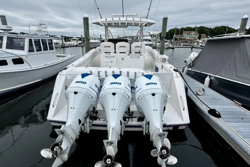 Slide: The Image of 2017 Stamas 390 Tarpon boat with triple 300 horsepower engines docked at marina. - 13