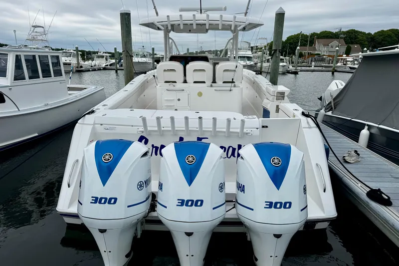 Slide: The Image of 2017 Stamas 390 Tarpon boat with triple Yamaha 300 engines docked at marina. - 14
