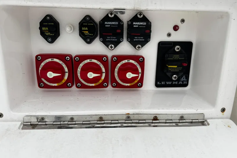 Slide: The Image of Electrical panel of a 2017 Stamas 390 Tarpon boat with switches and circuit breakers. - 16