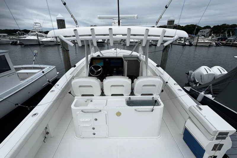 Slide: The Image of 2017 Stamas 390 Tarpon boat docked, featuring a spacious cockpit and modern controls. - 11