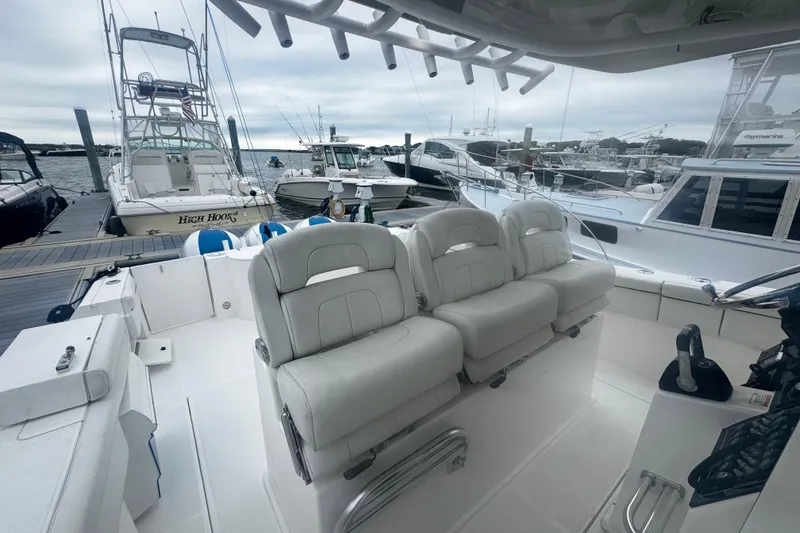 Slide: The Image of 2017 Stamas 390 Tarpon boat interior with white seating at marina. - 10