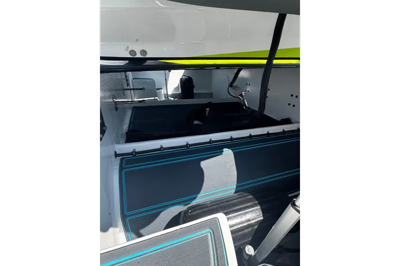 Slide: The Image of Interior view of a 2022 MTI 48 boat, showcasing seating and storage areas. - 17