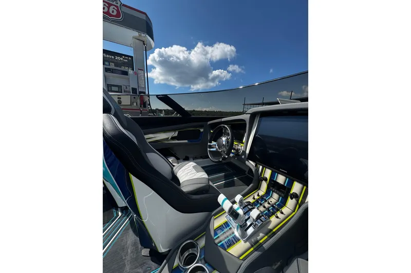 Slide: The Image of Interior of a 2022 MTI 48 boat with modern controls and sleek design. - 2