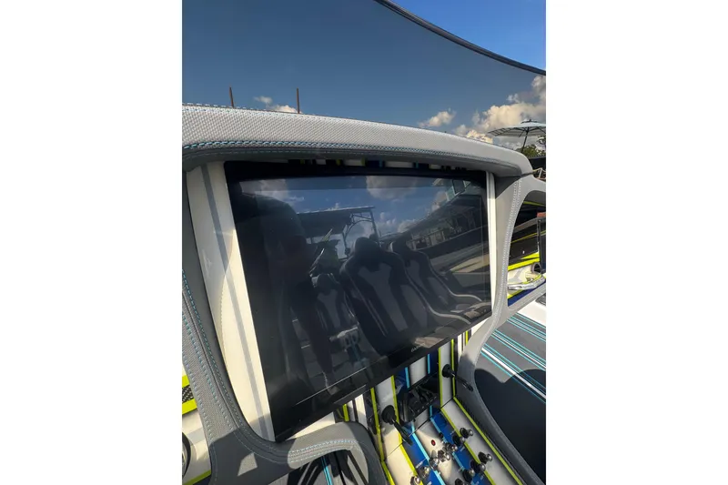 Slide: The Image of 2022 MTI 48 boat dashboard with touchscreen display and modern controls. - 9