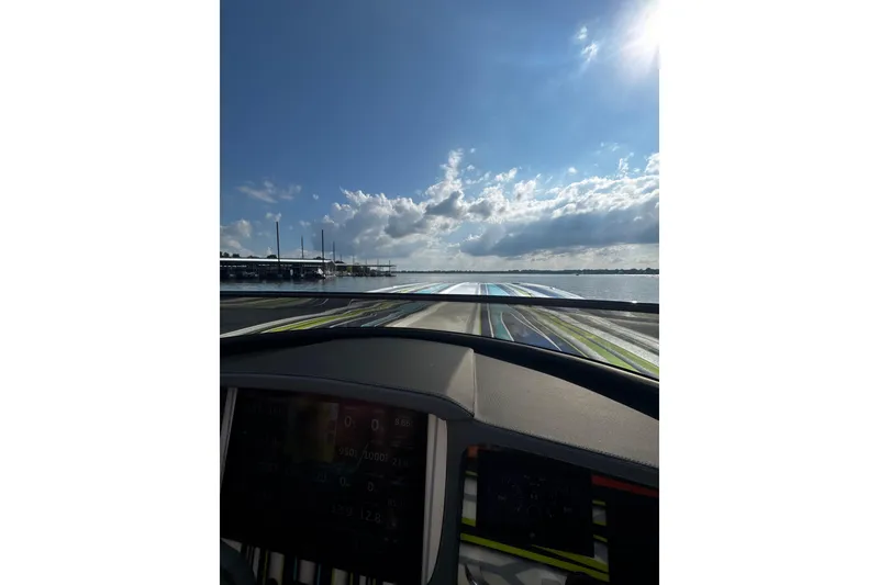 Slide: The Image of Cockpit view from a 2022 MTI 48 boat, cruising on a sunny day. - 16