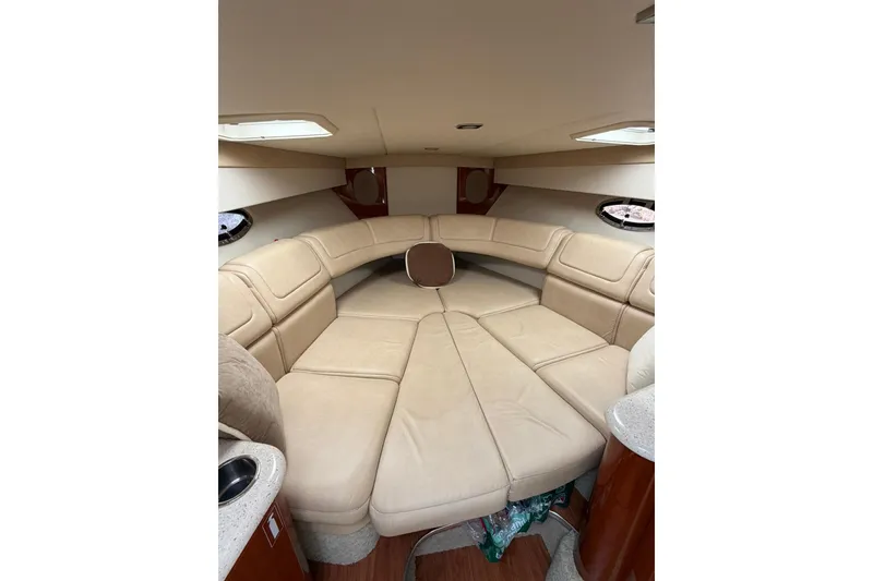 Slide: The Image of Interior of a 2009 Formula 310 Sun Sport boat with beige leather seating. - 10