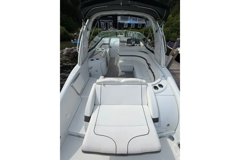 Slide: The Image of 2009 Formula 310 Sun Sport boat interior with white seating and sleek design. - 5