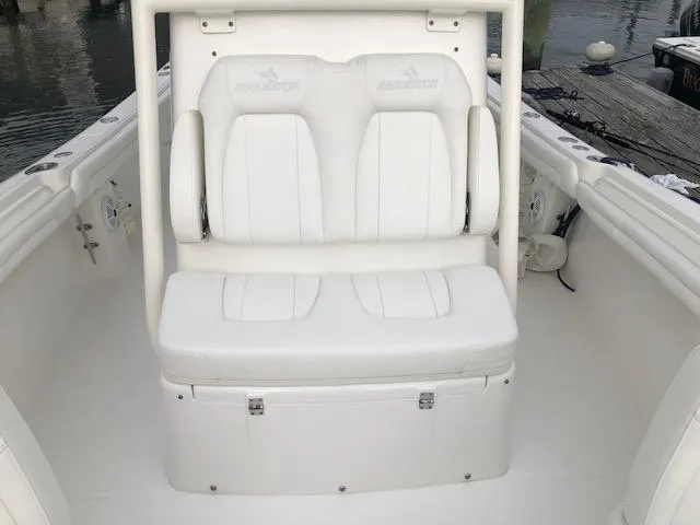 Slide: The Image of The image shows the white seating area of a 2019 Regulator 23 Forward Seating boat. - 11