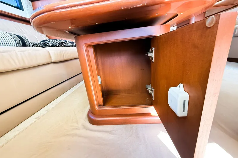 Slide: The Image of Open wooden cabinet inside 2004 Silverton 48 Convertible yacht interior. - 41