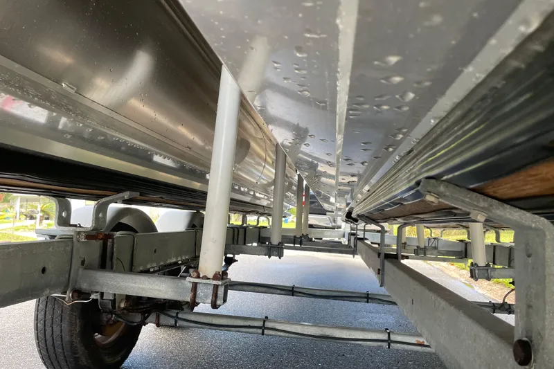 Slide: The Image of Underneath view of a 2022 Barletta Cabrio 22QC boat on a trailer. - 54