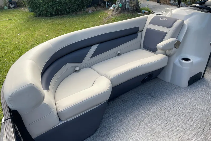 Slide: The Image of 2022 Barletta Cabrio 22QC boat interior with plush seating and modern design. - 24