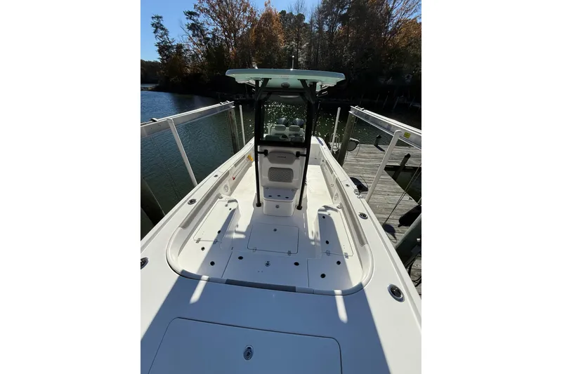 Slide: The Image of 2023 Caymas 281 HB boat docked by a serene lake with autumn trees. - 52
