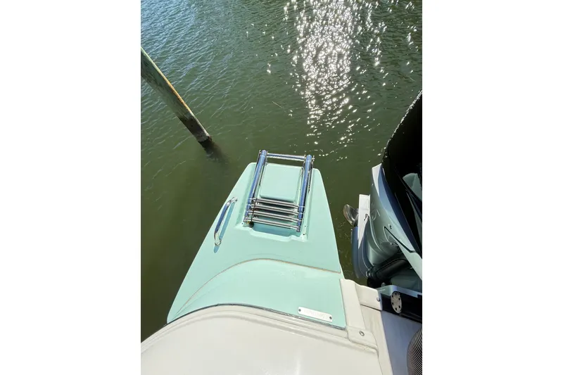 Slide: The Image of 2023 Caymas 281 HB boat with swim platform and ladder on water. - 61