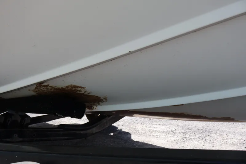 Slide: The Image of 2007 Boston Whaler 180 Dauntless boat hull with visible damage on trailer. - 21