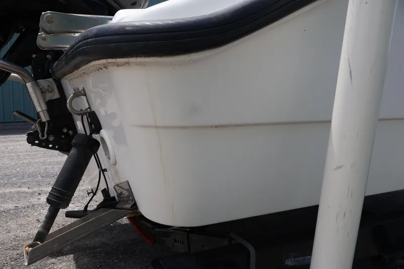 Slide: The Image of Close-up of a 2007 Boston Whaler 180 Dauntless boat's rear section on a trailer. - 20