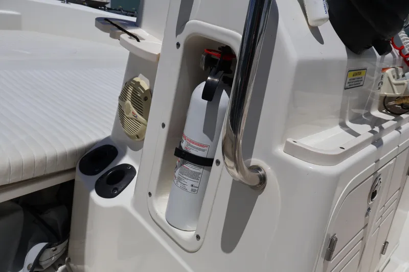 Slide: The Image of 2007 Boston Whaler 180 Dauntless boat interior with fire extinguisher and speaker. - 27