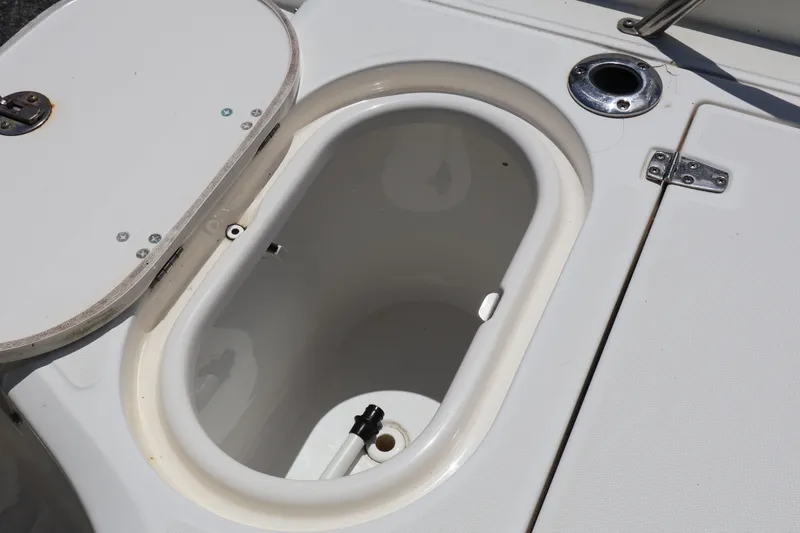 Slide: The Image of Open storage compartment on a 2007 Boston Whaler 180 Dauntless boat. - 53