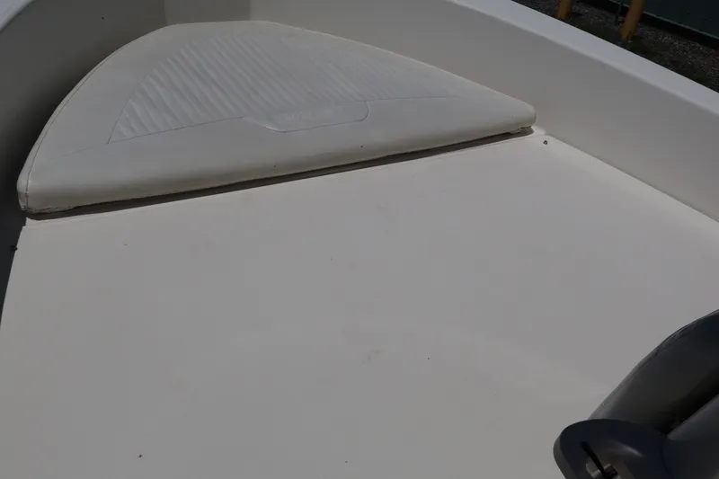 Slide: The Image of 2007 Boston Whaler 180 Dauntless boat interior with cushioned seating area. - 31