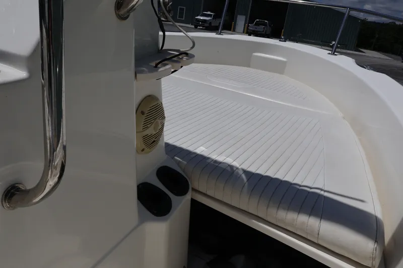 Slide: The Image of 2007 Boston Whaler 180 Dauntless boat interior with cushioned seating and speaker. - 29