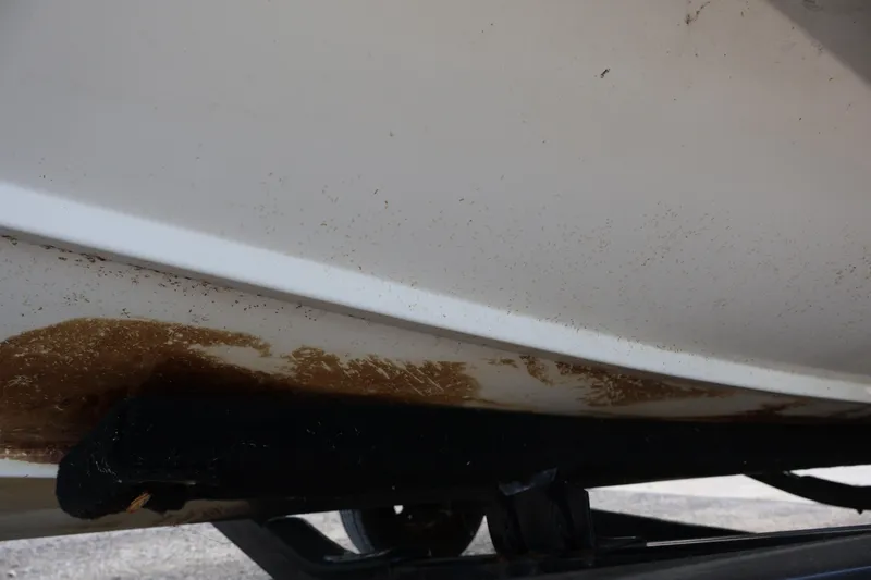 Slide: The Image of Close-up of 2007 Boston Whaler 180 Dauntless boat hull with visible wear and dirt. - 7
