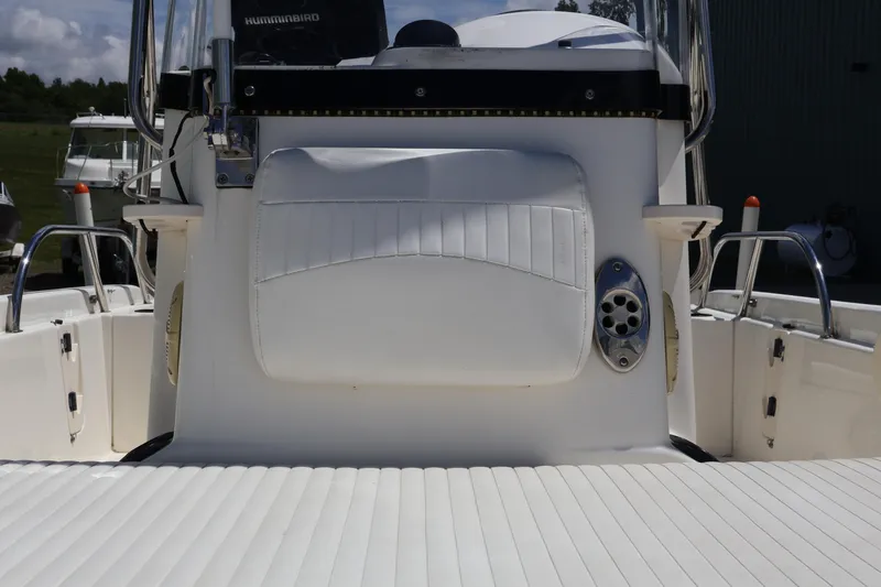 Slide: The Image of 2007 Boston Whaler 180 Dauntless boat interior with white seating and console details. - 33