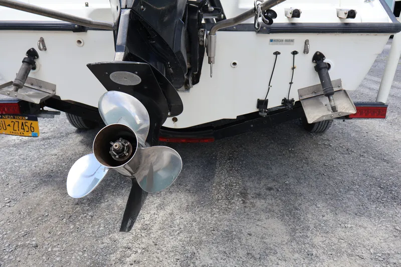 Slide: The Image of Rear view of a 2007 Boston Whaler 180 Dauntless boat with propeller and license plate. - 14