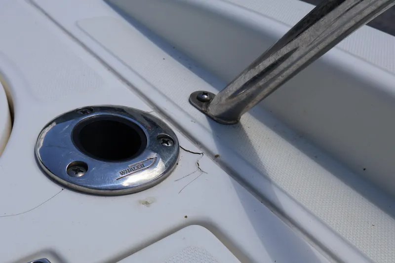 Slide: The Image of Close-up of a 2007 Boston Whaler 180 Dauntless boat's metal fitting and rod holder. - 56