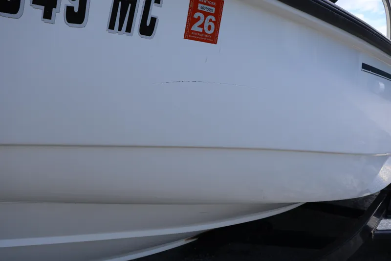 Slide: The Image of 2007 Boston Whaler 180 Dauntless boat hull with registration sticker. - 5