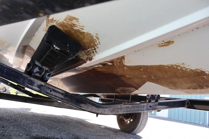 Slide: The Image of Underside of a 2007 Boston Whaler 180 Dauntless boat on a trailer. - 23