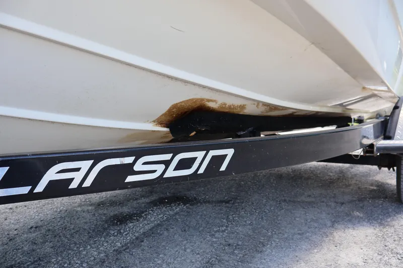 Slide: The Image of 2007 Boston Whaler 180 Dauntless on Larson trailer, showing hull condition. - 24