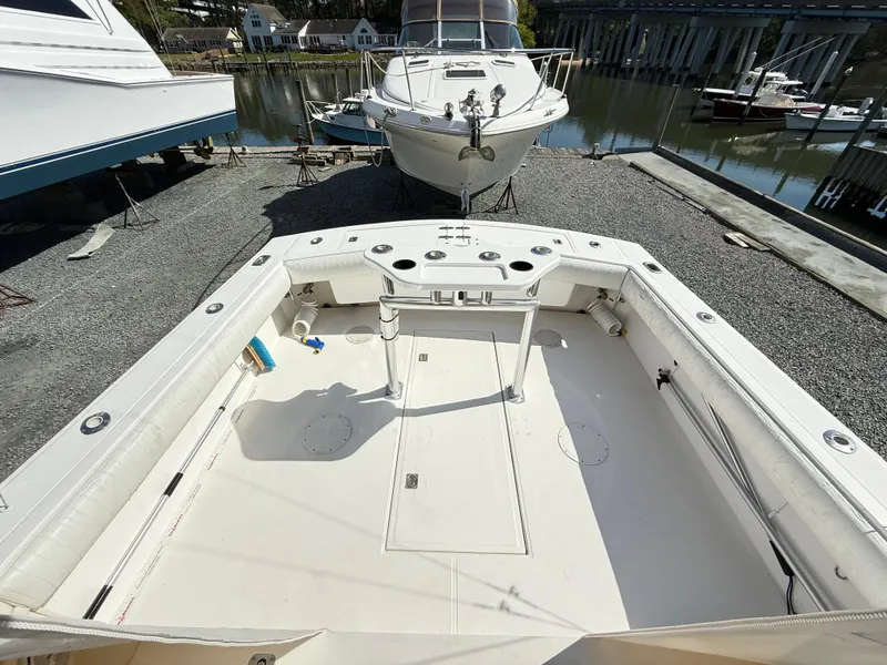 Slide: The Image of 2001 Albemarle 280 Express Sport Fisherman boat, spacious deck, docked near water. - 45