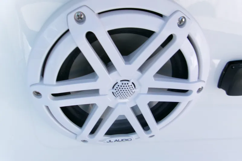 Slide: The Image of White JL Audio speaker on 2026 Monterey Elite 25 SD boat. - 14