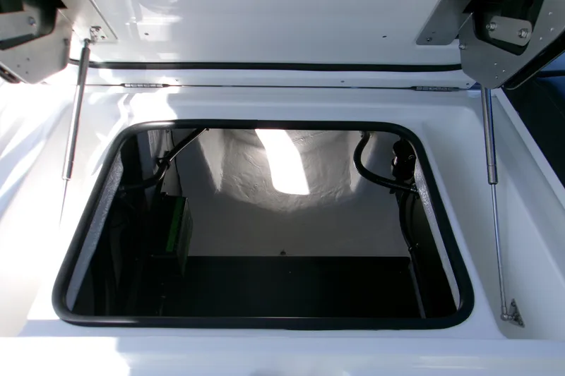 Slide: The Image of Open storage compartment in 2026 Monterey Elite 25 SD boat. - 6