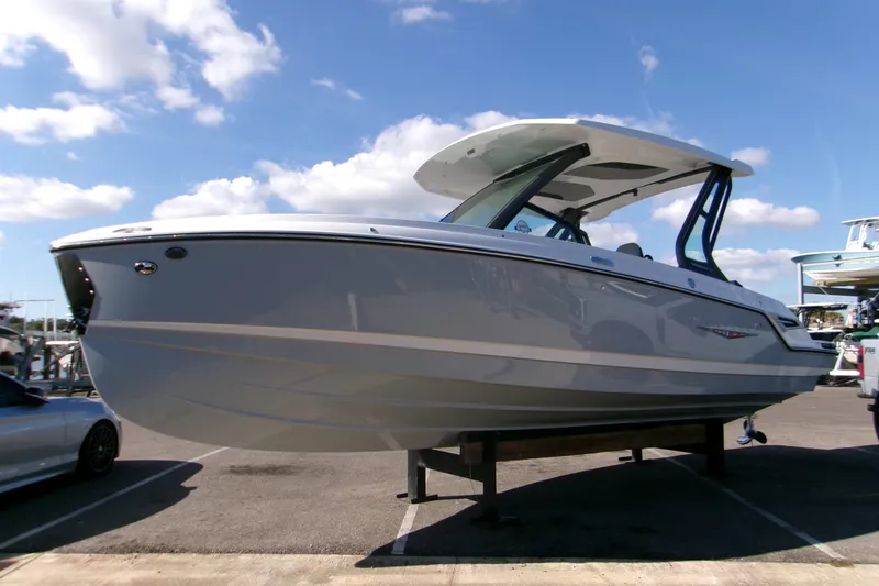 The Image of 2026 Monterey Elite 25 SD boat displayed outdoors under a clear blue sky. - 0