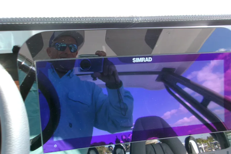 Slide: The Image of Reflection on Simrad display in 2026 Monterey Elite 25 SD boat cockpit. - 8
