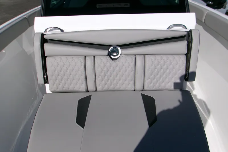 Slide: The Image of 2026 Monterey Elite 25 SD boat interior with luxurious quilted seating. - 11