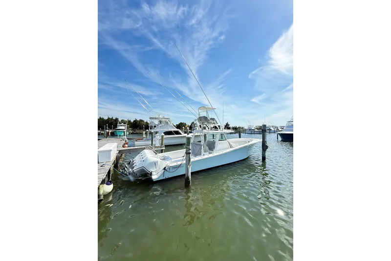 Slide: The Image of 2022 Onslow Bay 41 Tournament boat docked under clear blue sky. - 45