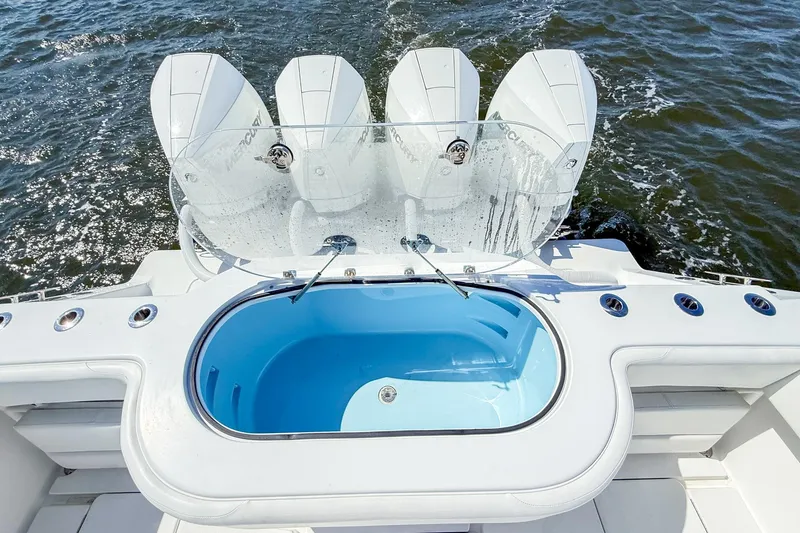 Slide: The Image of 2022 Onslow Bay 41 Tournament boat with four engines and a livewell on the water. - 28