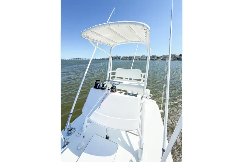 Slide: The Image of 2022 Onslow Bay 41 Tournament boat on water, featuring elevated helm and canopy. - 35