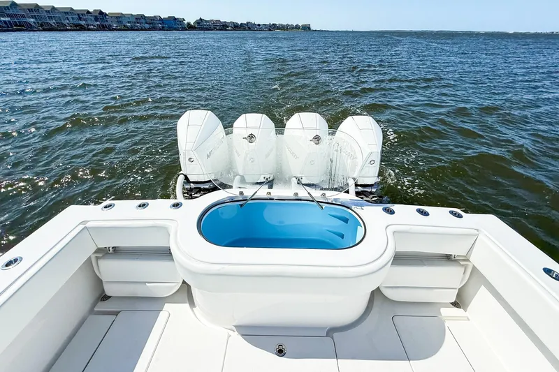 Slide: The Image of Onslow Bay 41 Tournament 2022 boat with quad engines on open water. - 27
