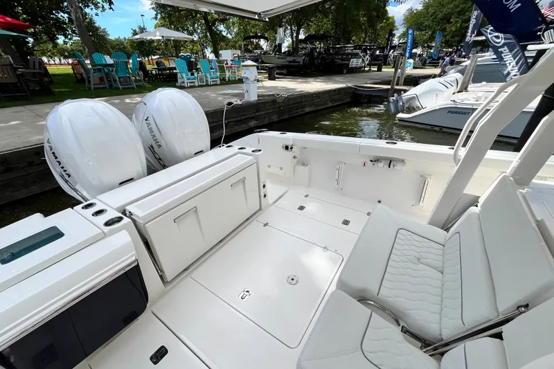 Slide: The Image of 2027 Pursuit S 358 Sport boat interior with Yamaha engines at a marina. - 6